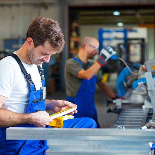 Factory workers in industrial setting